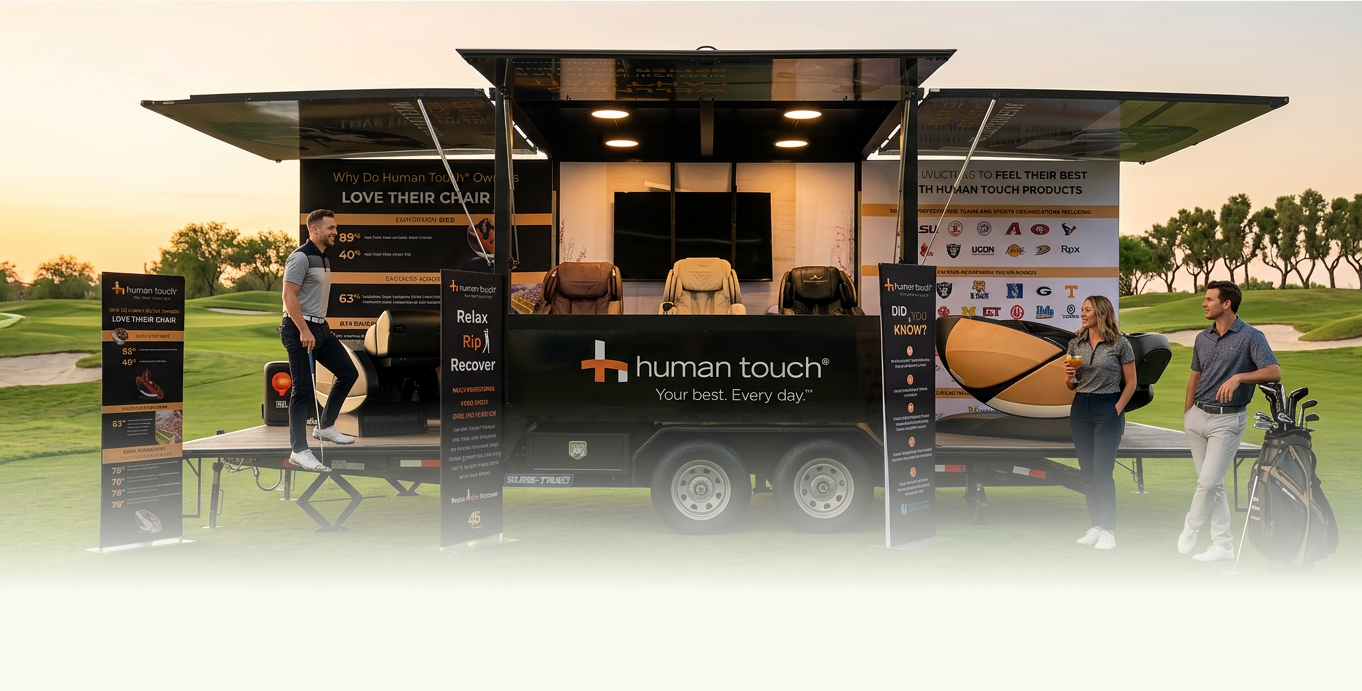 Human Touch mobile massage chair trailer set up on a golf course